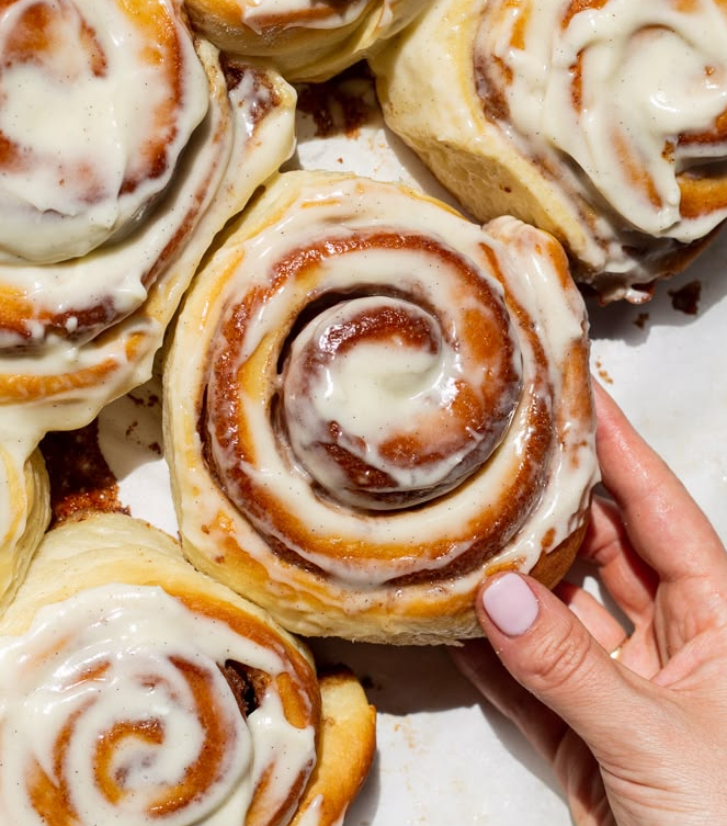 Freshly baked cinnamon buns with cream cheese glaze